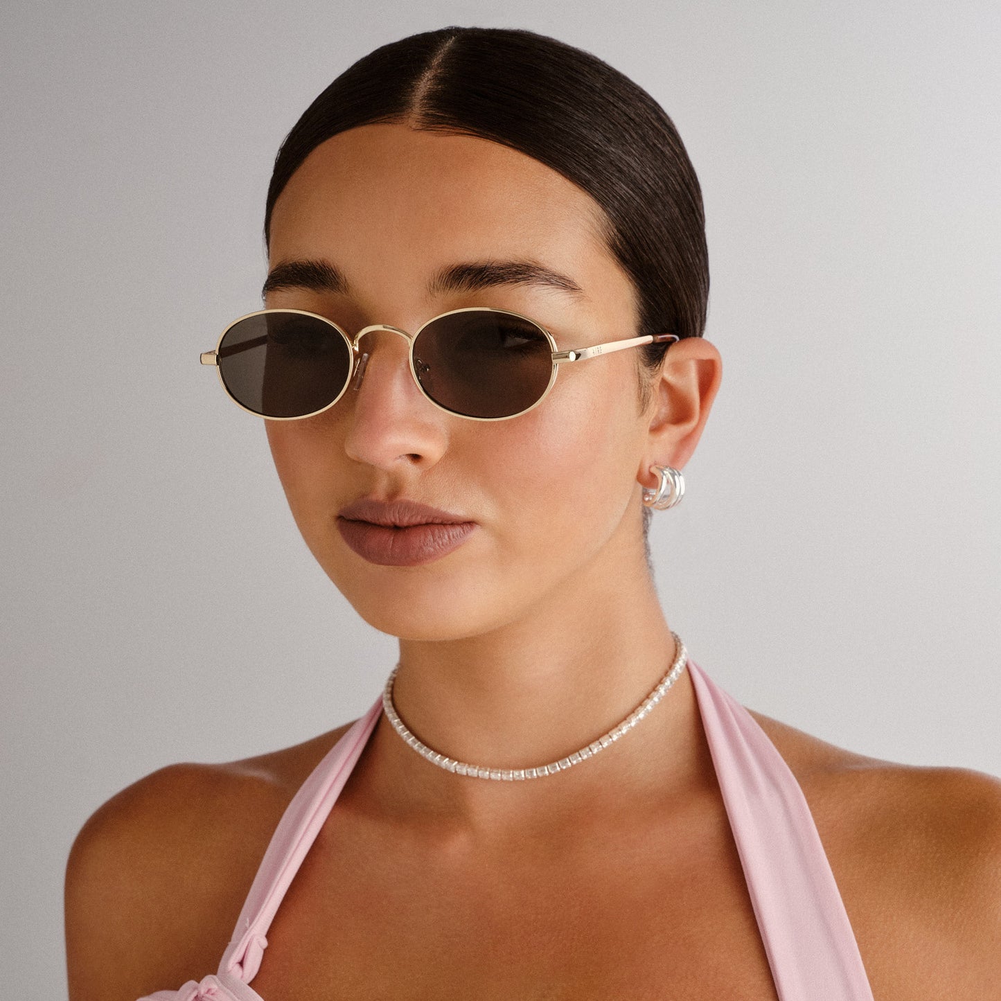 Regulus Gold Female Oval Sunglasses | Aire