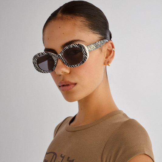 Dazed Zebra Vintage White Female Oval Sunglasses | Aire