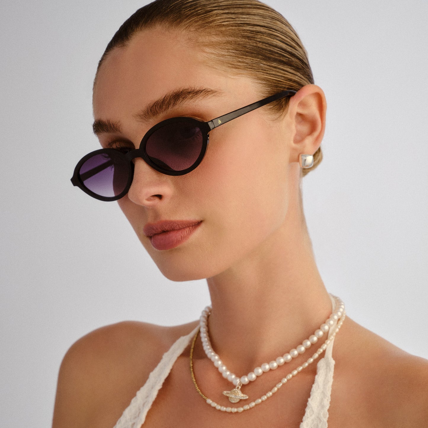 Pyxis Black Female Oval Sunglasses | Aire