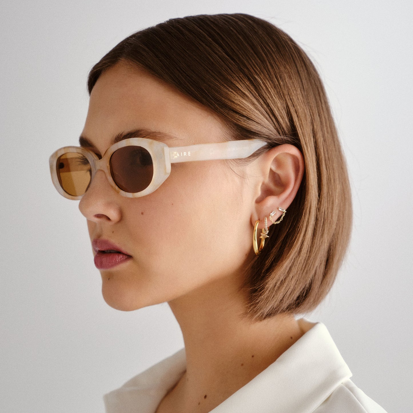 Affinity Yellow Marble Uni-Sex Oval Sunglasses | Aire