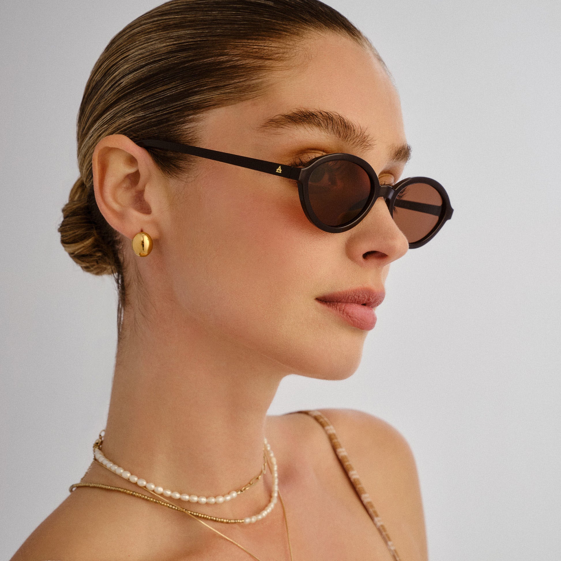 Pyxis Chocolate Female Oval Sunglasses | Aire