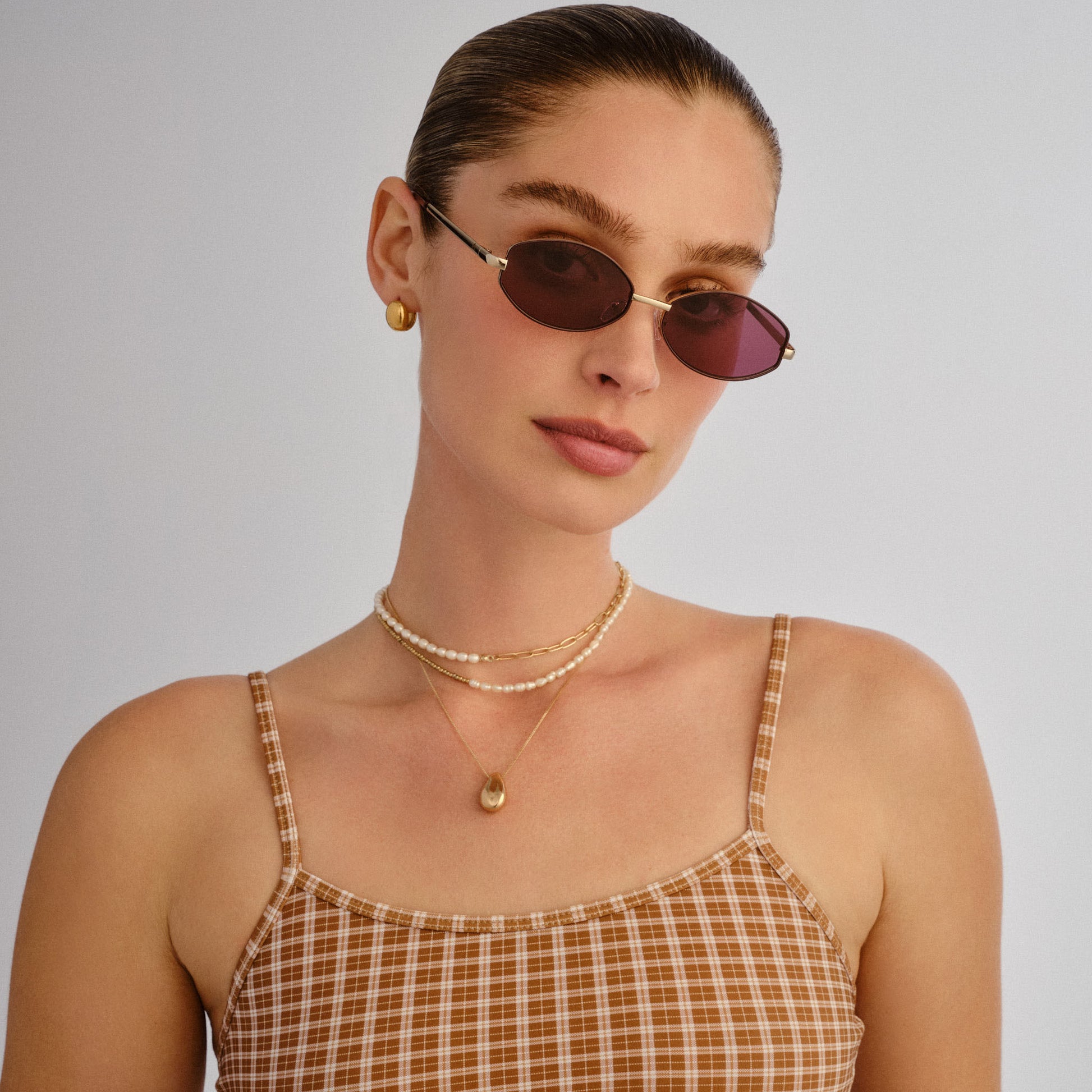 Objective Gold Burgundy Mono Female Oval Sunglasses | Aire