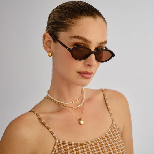 Pyxis Chocolate Female Oval Sunglasses | Aire