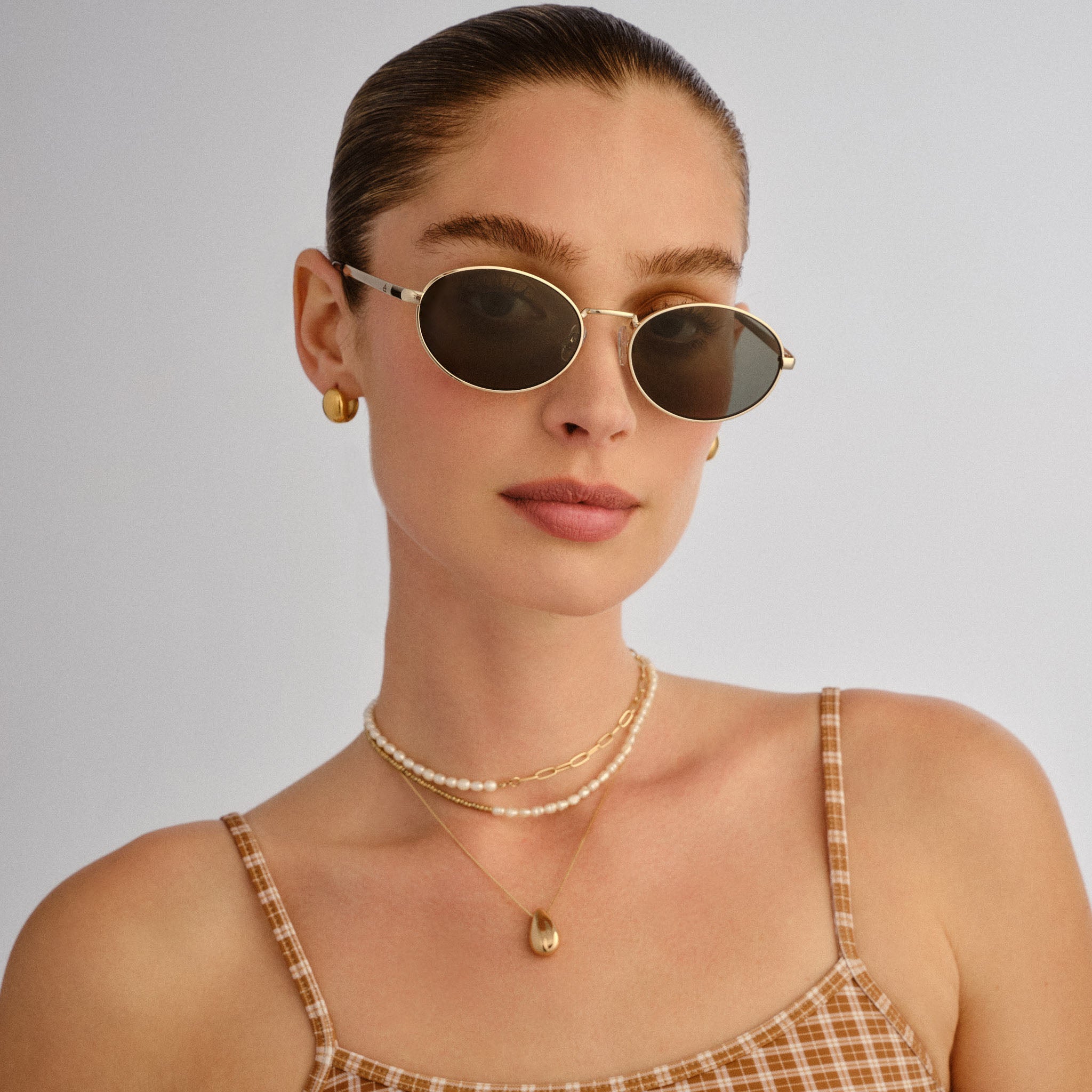 Ephermeris Gold Uni-Sex Oval Sunglasses | Aire – AIRE US